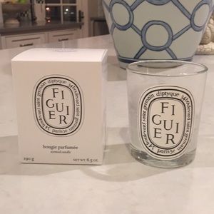 Empty Diptyque candle and box